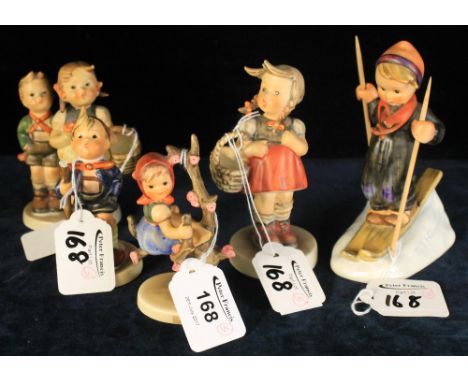 Five Goebel Hummel figures to include boy skiing, children with baskets etc.  (5)(B.P. 24% incl. VAT)   CONDITION REPORT:  Sm