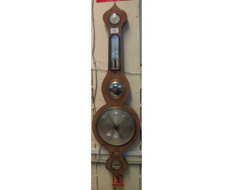Mahogany wheel barometer with silvered face.(B.P. 24% incl. VAT)