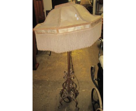Metal standard lamp converted from an oil burner on quatroform base. (B.P. 24% incl. VAT)