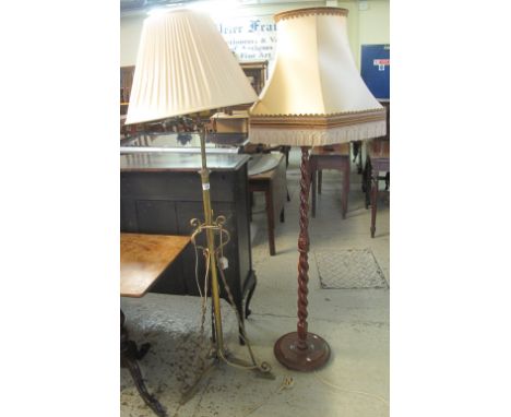 Brass extendable standard lamp on a triform base, together with a modern mahogany finish barley twist standard lamp with shad