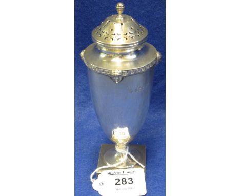 Silver ovoid shaped pierced caster raised on square section base, overall decorated with Greek key design and mask mounts. Bi