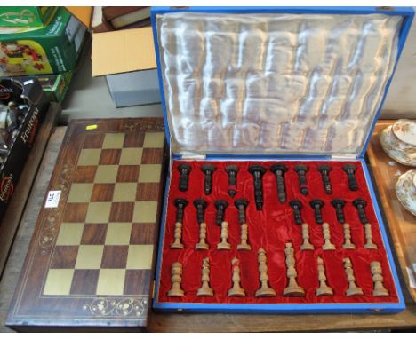 Modern carved hardwood chess set in fitted case (possibly Indian), together with a modern hardwood draughts folding board.  (