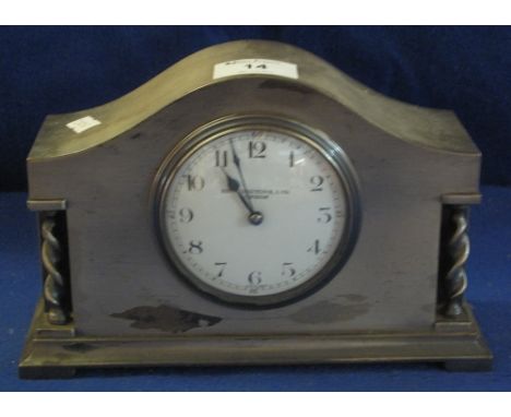 Mid century silver plated arched mantle clock with circular enamel Arabic dial marked Braningtons Ltd. London. (B.P. 24% incl
