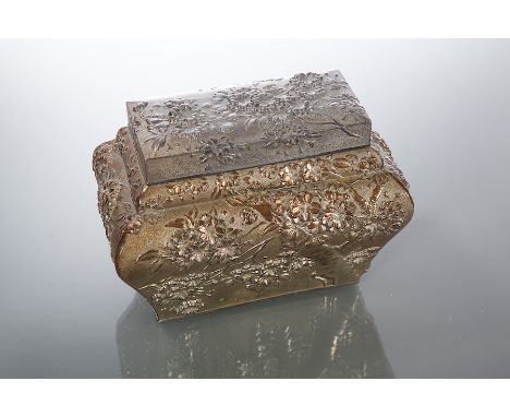 JAPANESE WHITE METAL TEA CADDY
embossed with floral and foliate designs, the inner cover with floral finial, 12cm high, 15cm 