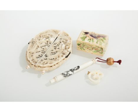 CHINESE CANTON IVORY PHOTOGRAPH FRAME
with two double doors opening to reveal a portrait oval, with pierced dragon decoration