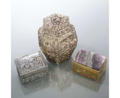 JAPANESE WHITE METAL TRINKET BOX AND TEA CADDY
the trinket box with embossed floral motifs, 5.5cm wide; the tea caddy with em