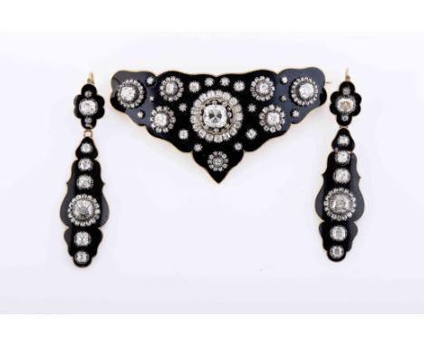 A demi-parure - brooch and pair of earringsA demi-parure - brooch and pair of earrings, gold decorated with black enamel, bro