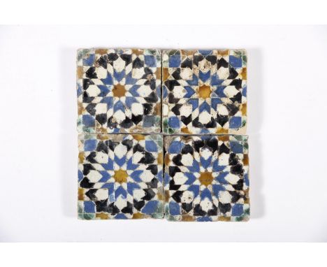 A four tile panelA four tile panel, polychrome decoration "Rosaceae" applied using the arista technique, Hispano-Arabic, 16th