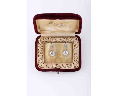 A pair of earringsA pair of earrings, gold and platinum, set with 2 antique brilliant cut diamonds with the approximate weigh