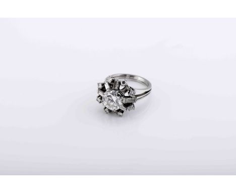 A ringA ring, 500/1000 platinum, set with 8 brilliant cut diamonds weighing approximately 0.40 ct., 8 baguette cut diamonds w