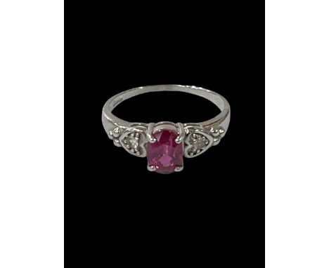 Ruby and diamond 9 carat white gold ring, size P.