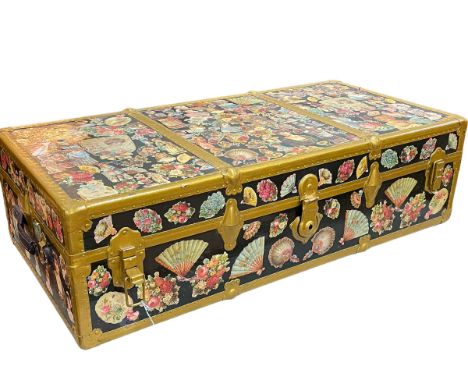 Vintage travelling trunk decorated with Victorian scrap cuttings, 32cm by 109cm by 55cm.