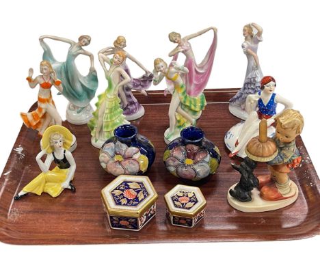 Two squat Moorcroft Pottery vases, Hummel figure, nine Art Deco lady figures and two Royal Crown Derby lidded boxes.