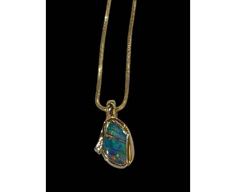 Opal and diamond 18 carat gold pendant with 18 carat gold chain necklace.
