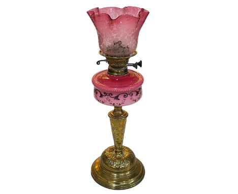Ornate Victorian oil lamp with painted pink porcelain reservoir and a pink etched shade, 56cm high.
