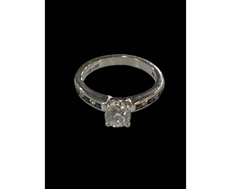 Diamond solitaire 18 carat white gold ring, approximately 0.5 carat, and with sapphire and diamond set shoulders, size L/M.