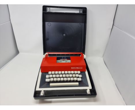 Petite International Deluxe Typewriter and case.