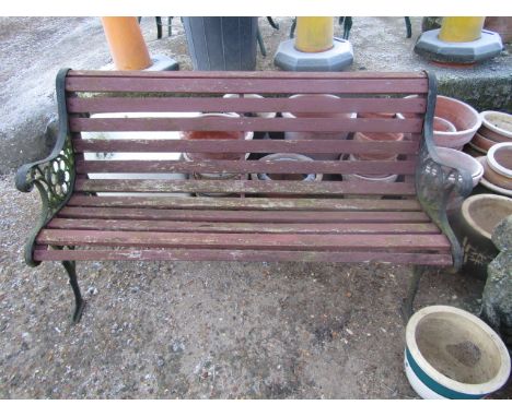 A wooden bench with cast iron ends