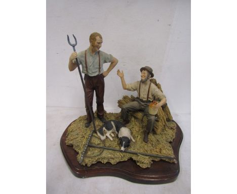 Border Fine Arts style figurine of two farmers and sheepdog sitting in raked hay on a wood plinth,&nbsp; stamped M Simpson 89