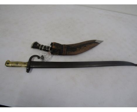 A St Etienne 1871 Bayonet with scabbard plus a Kukri in sheath with both shackles   age restrictions apply to these items. 