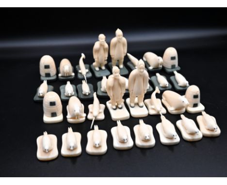 Attributed to Pacome Kolaut (Inuit, Iglulik, 1925-1968), chess set of indigenous figures, seals; walrus; narwhals and igloos 