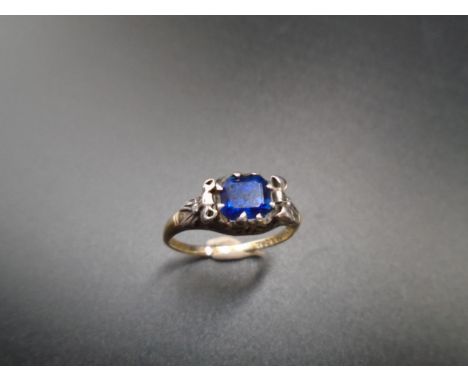 18ct gold and platinum Sapphire and Diamond ring. Marked Pascoe, has some damage to one shoulder and bow detail very worn on 