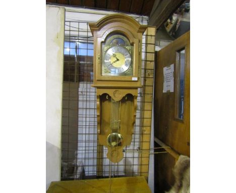 A German Interlock wall hung&nbsp; long cased clock with oak case, brass weights and key, plus manual