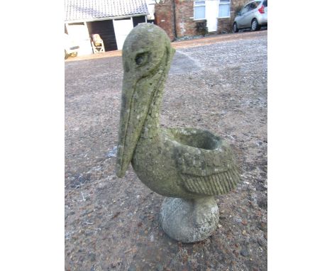 A concrete pelican plant pot holder/ planter