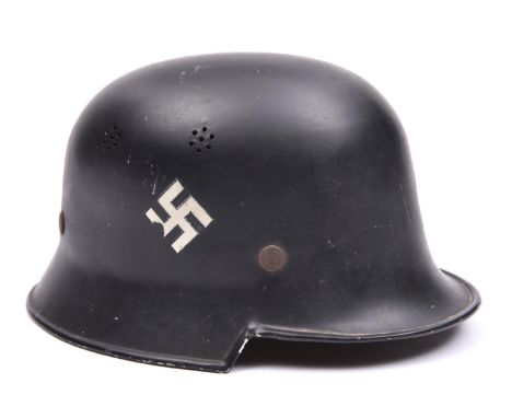 A Third Reich M34 Police light weight square dip helmet, black with white swastika and diagonal national shield decals, the i