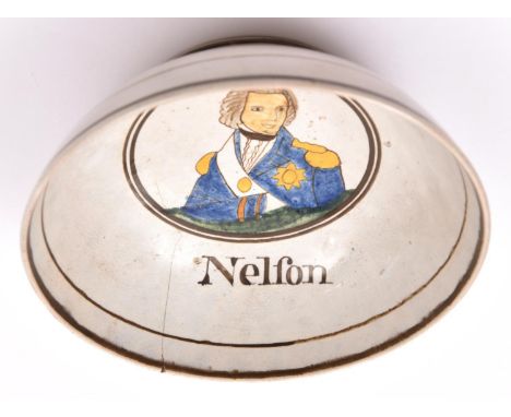 An early 19th century glazed earthenware bowl,  decorated with a naive coloured depiction of Nelson, and inscribed “Nelfon” (