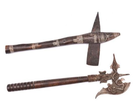 An African agricultural axe, with flat iron blade and wooden haft decorated with bands of white concentric circles; also a fa