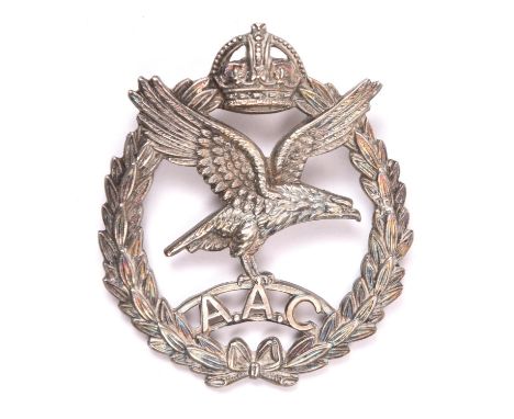 An officer’s silver cap badge of the Army Air Corps,  HM B’ham 1942 and with J R Gaunt maker’s mark, lugs removed and fitted 