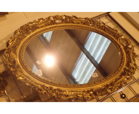 Large ornate oval gilt framed mirror 90 x 65 cm 