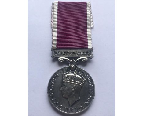 A GEORGE VI LONG SERVICE AND GOOD CONDUCT MEDAL. A George VI Long Service and Good Conduct medal with Regular Army suspension