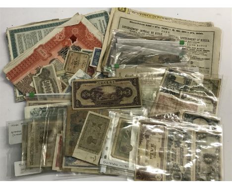 A LARGE COLLECTION OF BANK NOTES AND SHARE CERTIFICATES. Numerous share certificates, many Russian and banknotes to include G