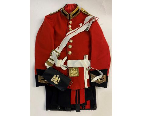 A CHILD'S SIZE SCARLET TUNIC, TROUSERS AND ACCESSORIES. A Life Guard's child's size eight button scarlet jacket with braid mo