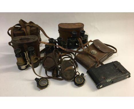 A COLLECTION OF FIRST WORLD WAR AND LATER COMPASSES AND BINOCULARS. Comprising a 1916 Verner's pattern compass by Cruchon &am