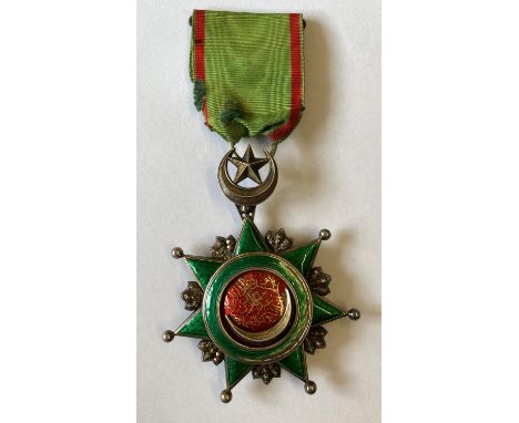 THE TURKISH ORDER OF OSMANIEH. A Turkish Empire Order of Osmanieh breast award on green and red ribbon with star and crescent