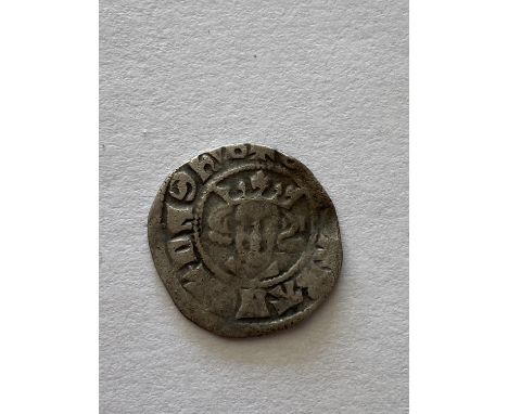 AN EDWARD I HAMMERED PENNY. An Edward I hammered silver penny , crowned facing portrait, long cross and pellets to the revers