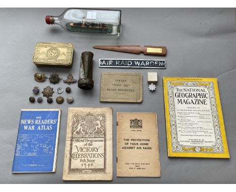 A COLLECTION OF FIRST WORLD WAR AND LATER ARTEFACTS AND EPHEMERA. A Queen Mary Christmas 1914 tin (lacking contents) a chrome