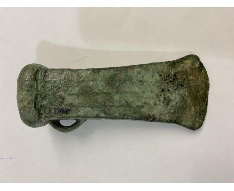 A BRONZE AGE LOOPED AND SOCKETTED AXEHEAD. 1000 - 500 BC, a substantial looped and socketed axe head with a straight flared c