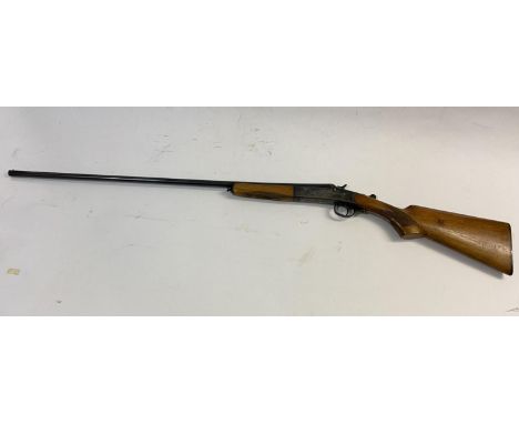 A SPANISH 410 SINGEL BARREL SHOTGUN. With a 75cm barrel marked 'made in Spain' and with various proof marks, the side plates 