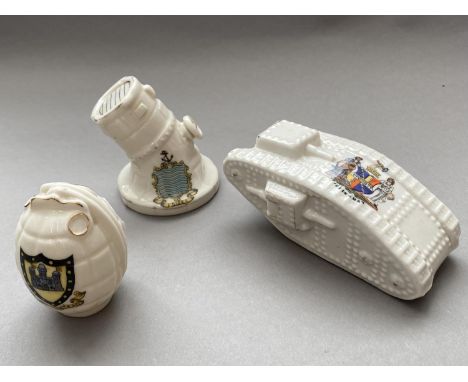 THREE PIECES OF FIRST WORLD WAR CRESTED CHINA. A first World War tank by Arcadian China with a Birmingham crest, a grenade by