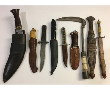A COLLECTION ON NINE CEREMONIAL AND HUNTING KNIVES. Nine knives, eight with scabbards including a Kukri type knife, an Easter
