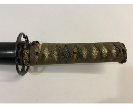 A JAPANESE SHORT SWORD IN LACQUERED SCABBARD. With a 47.5cm single edged blade, the Tsuba with scrolling stylized birds heads