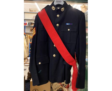 A ROYAL MARINES No.1 DRESS JACKET. A No.1 Dress Jacket Size 25A by H, Edgard and Sons with red sash and parachute wings, with