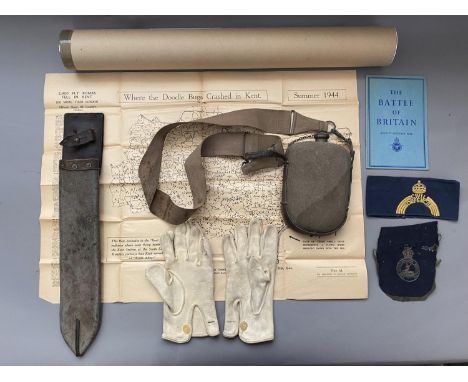 A SMALL COLLECTION OF MILITARIA. Comprising a fabric covered water bottle on a broad webbing and leather strap, a post Second