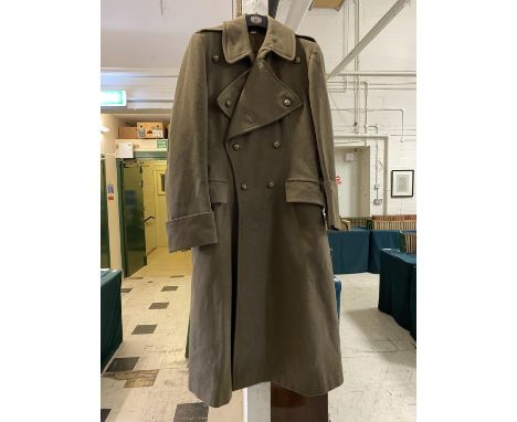 AN ARMY OFFICERS GREAT COAT. A heavy khaki Great Coat with Royal Artillery buttons, the cannon beneath a King's Crown, and a 