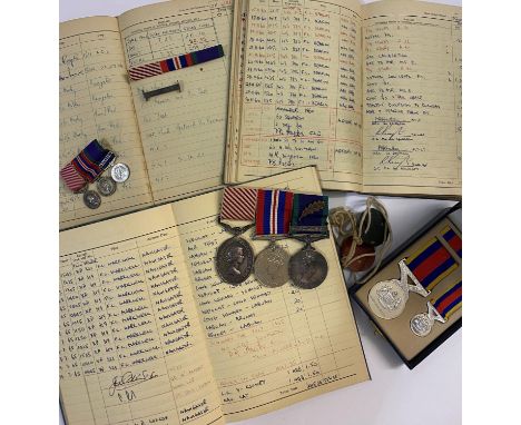 AN AIR FORCE MEDAL GROUP, LOG BOOKS AND ARCHIVE TO FLIGHT SERGEANT HAWKER. A group of three comprising Air Force Medal named 