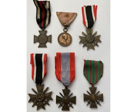 A COLLECTION OF SIX VARIOUS FIRST AND SECOND WORLD WAR MEDALS. A collection of six awards: A German Great War Honour Cross wi